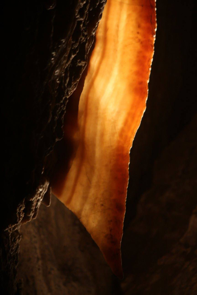 A strip of a cave formation called cave bacon in Jewel Cave