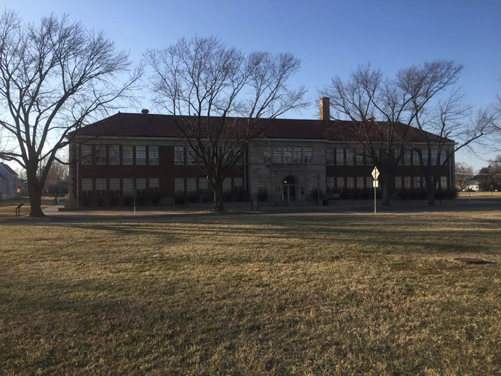 List of National Parks by State: A Complete List of All 400+ US National Parks 29 A large, wide brick building surrounded by trees on a large grass lawn