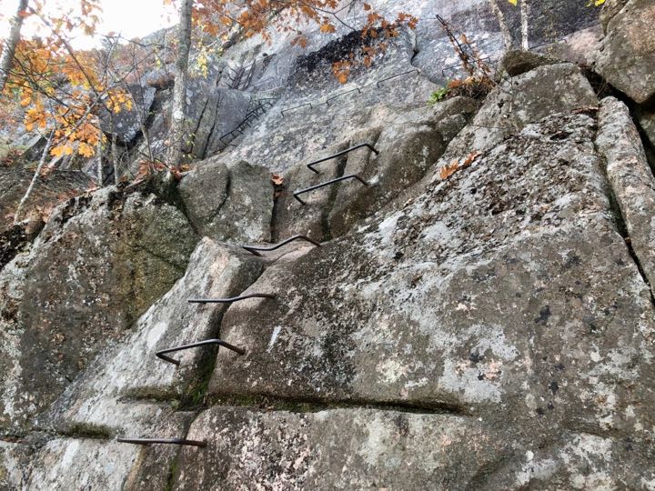 How to Hike the Heart-Stopping Precipice Trail in Acadia National Park 13 A series of iron ladders lead to the top of a mountain