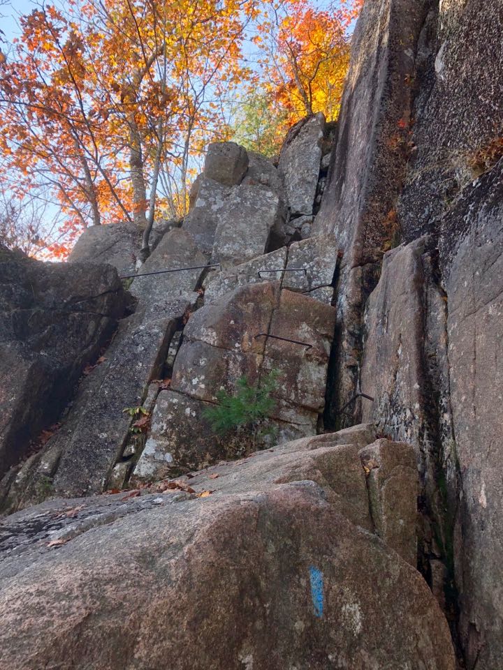 How to Hike the Heart-Stopping Precipice Trail in Acadia National Park 15 A series of iron ladders lead to the top of a mountain