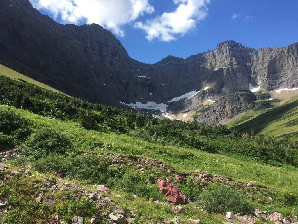 Glacier National Park 1 A green hillside below Mt. Siyeh and small glaciers in Glacier National Park