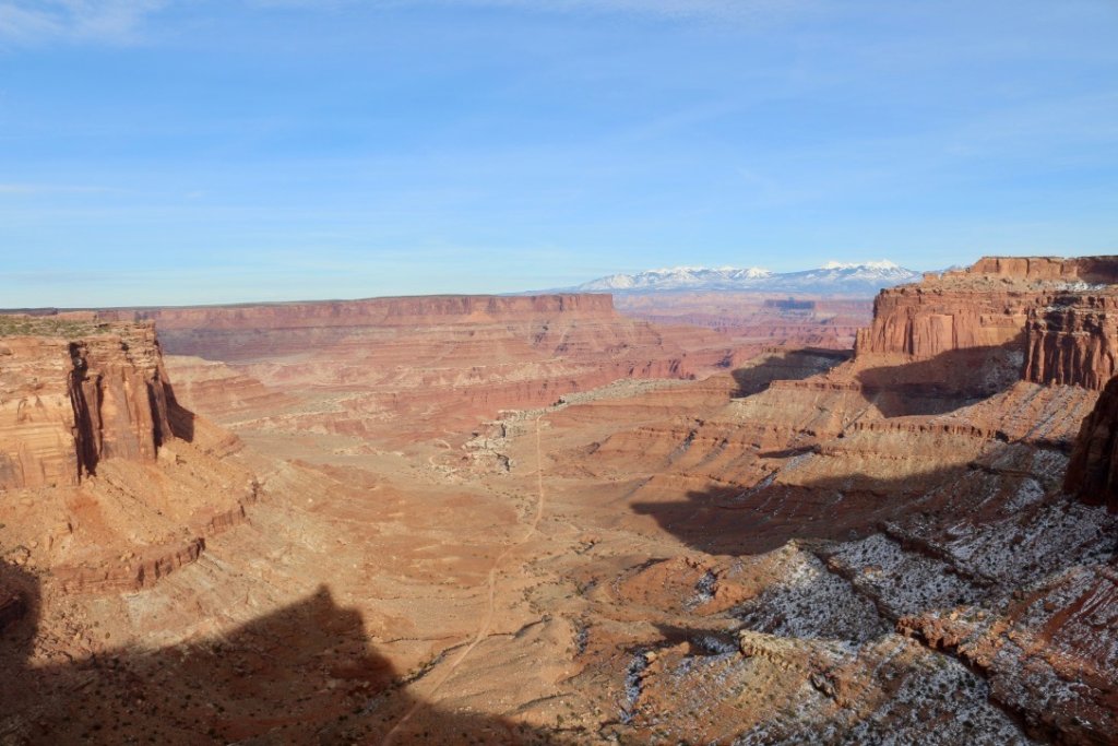 Visiting Canyonlands National Park: The Expert Travel Guide 6 An overlook of Canyonlands National Park that showcases the canyon and a road that goes through it