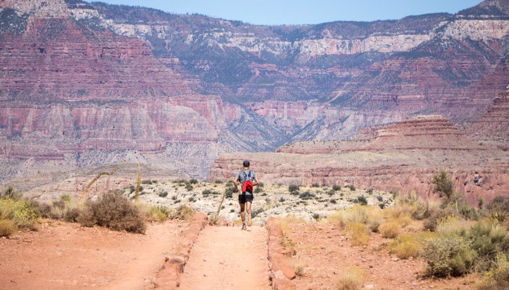 Visiting Grand Canyon National Park: The Expert Travel Guide 8 A man running on a trail in Grand Canyon National Park