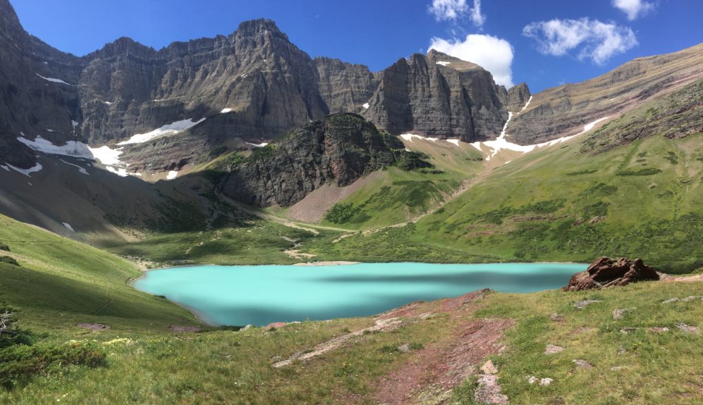 A List of All 63 National Parks in the U.S. Ranked by Their Popularity 31 Cracker Lake, a bright turquoise blue below mountains, in Glacier, one of the US national parks