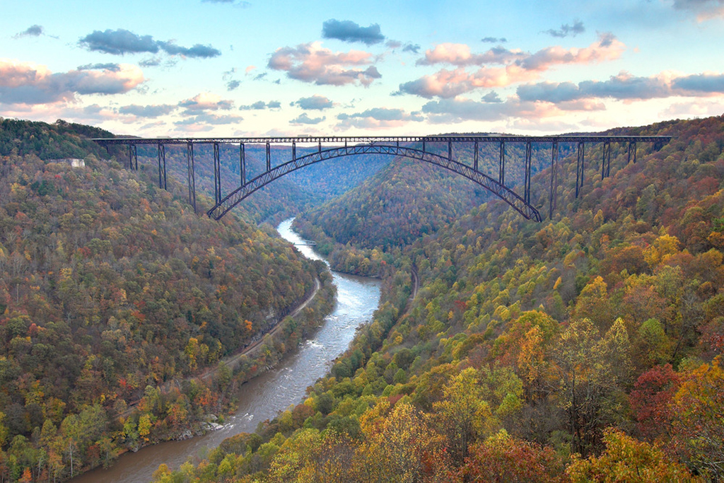 A List of All 63 National Parks in the U.S. Ranked by Their Popularity 38 A historic bridge forges a river during the fall season