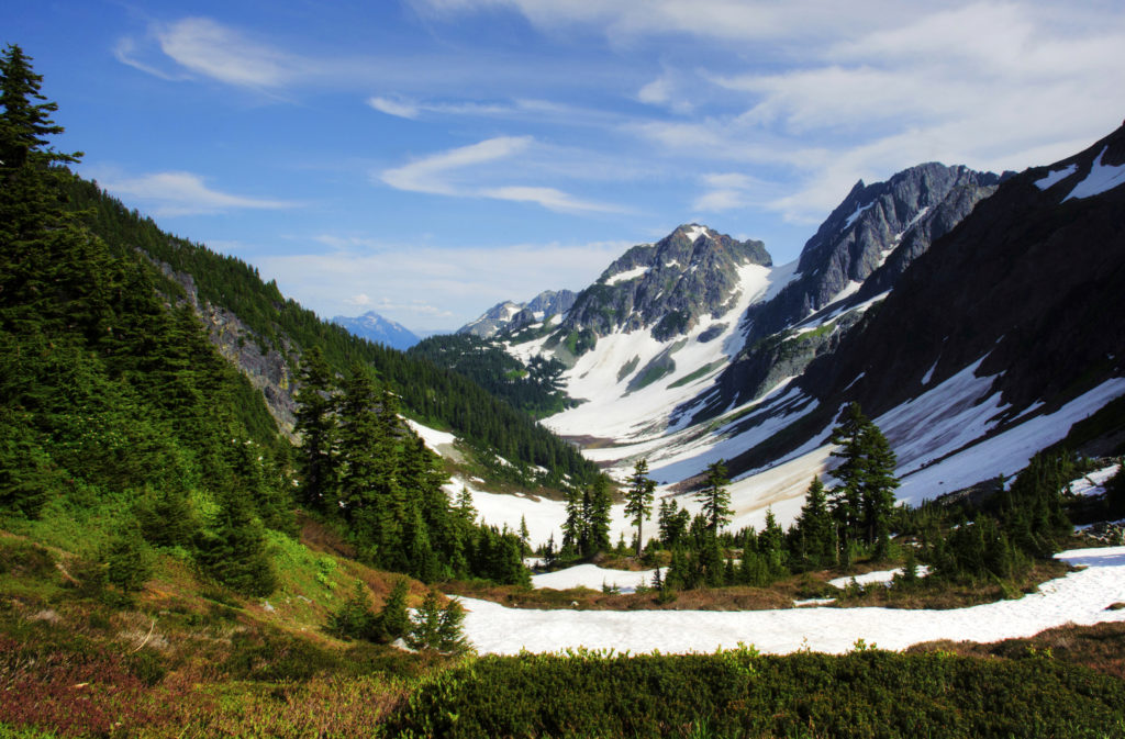 A List of All 63 National Parks in the U.S. Ranked by Their Popularity 78 Snow fills a basin in North Cascades, one of the US national parks