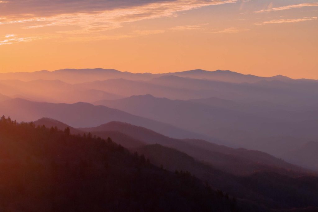 A List of All 63 National Parks in the U.S. Ranked by Their Popularity 20 The sun setting over the Great Smoky Mountains, one of the US national parks