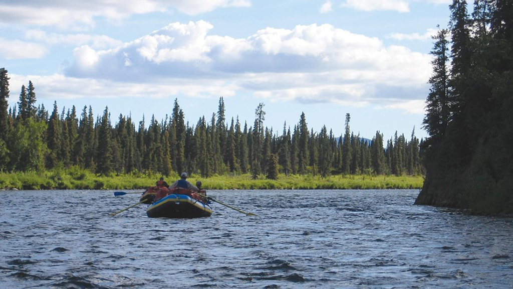 16 Astonishing National Parks in Alaska 5 People in a raft on the Alagnak River, one of the national parks in Alaska