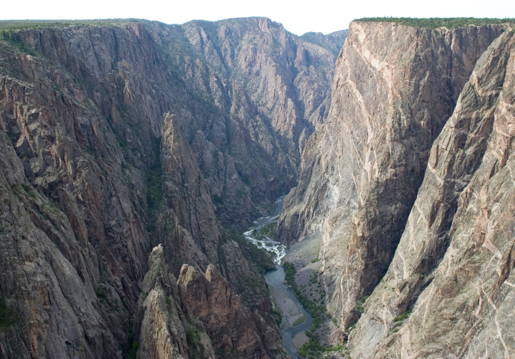 A river runs through a deep canyon at Black Canyon of the Gunnison, one of the locations with the best one-star reviews of national parks