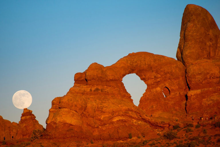 The Super Moon rises above Turret Arch, one of the best hikes in Arches National Park