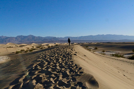 The 13 Best Hikes in Death Valley National Park You Won't Want to Miss 8 A woman walking on a sand dune. The Mesquite Flat Sand Dunes is one of the best hikes in Death Valley.