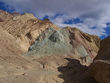 The 13 Best Hikes in Death Valley National Park You Won't Want to Miss 11 A dirt path into a brown and gray canyon. Desolation Canyon is one of the best hikes in Death Valley.