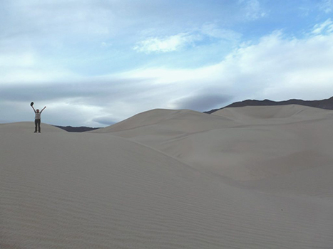 The 13 Best Hikes in Death Valley National Park You Won't Want to Miss 14 A hiker on top of a sand dune. Panamint Dunes is one of the best hikes in Death Valley.