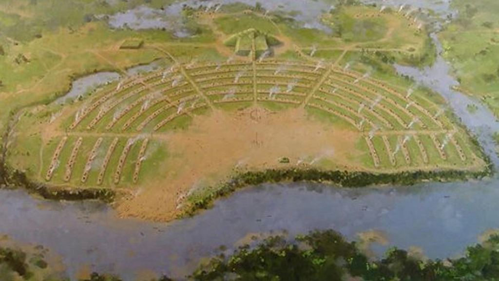 4 Lovely National Parks in Louisiana 8 An archaeological site photographed from the area shows brown, curved lines among green grass. Poverty Point is one of the national parks in Louisiana.