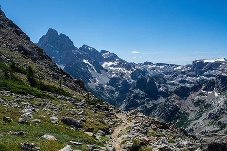 Best Hikes in Grand Teton: The 14 Best Long Day Hikes and Multi-Day Hikes in Grand Teton National Park 37 A trail makes its way through a mountainous canyon. Paintbrush Canyon and Cascade Canyon are two of the best hikes in Grand Teton National Park.
