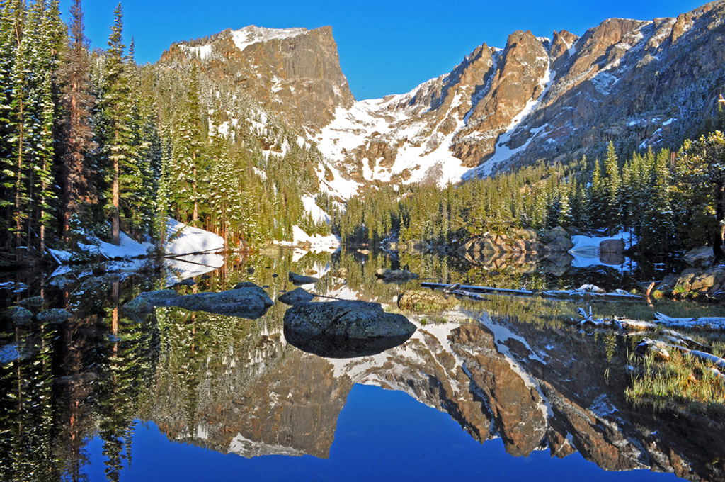 Rocky Mountain National Park 1 Hallett Peak, backed by bluebird skies, is reflected in the water of Dream Lake in Rocky Mountain National Park