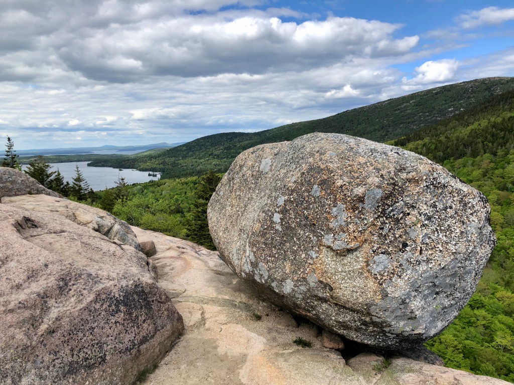 15 of the Best Hikes in Acadia National Park: Exploring Mount Desert Island 47 Bubble Rock, a glacial erratic, on the edge of a mountain overlooking Eagle Lake. The trail to Bubble Rock is one of the best hikes in Acadia National Park.
