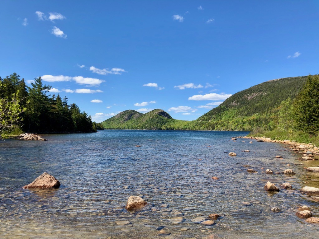 15 of the Best Hikes in Acadia National Park: Exploring Mount Desert Island 43 Two rounded mountains on the end of a clear lake. The path around Jordan Pond is one ofthe best hikes in Acadia National Park.