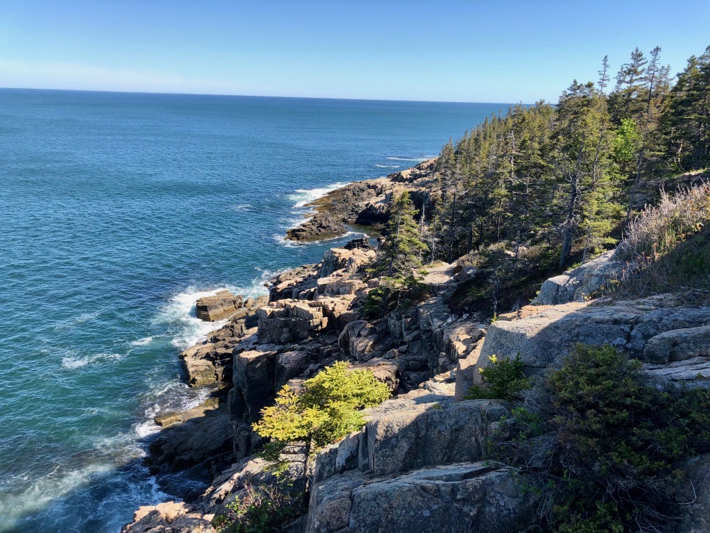 15 of the Best Hikes in Acadia National Park: Exploring Mount Desert Island 49 Rocks along the ocean shoreline. You can see the Ocean Path cutting through the rocks, one of the best hikes in Acadia National Park