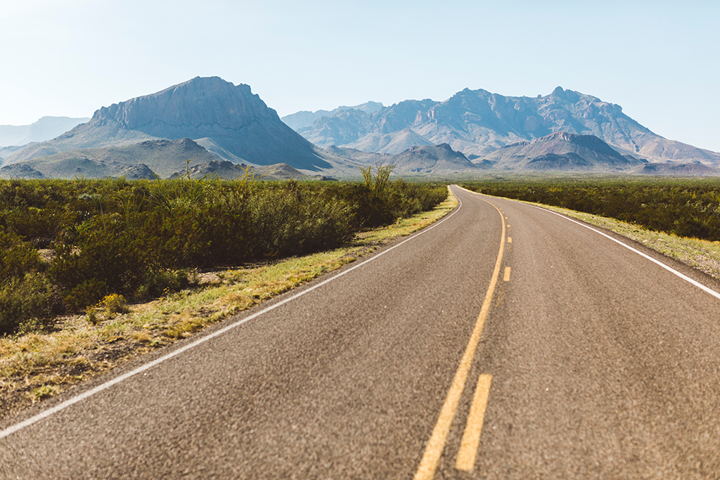 How to Spend 3 Days in Big Bend National Park: Itinerary 19 A paved road curves toward mountains in Big Bend National Park