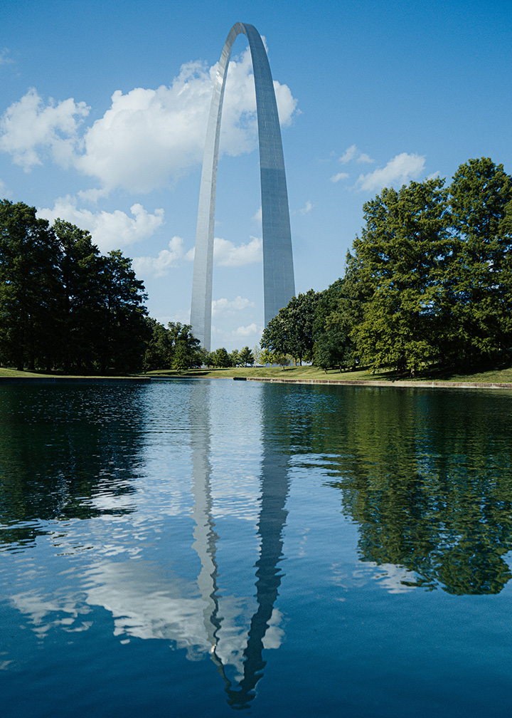 List of National Parks by State: A Complete List of All 400+ US National Parks 8 A large man-made metal arch reflected in a pond
