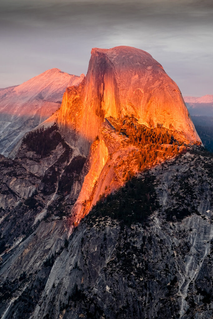 List of National Parks by State: A Complete List of All 400+ US National Parks 5 The setting sun casts an orange glow on a granite outcropping