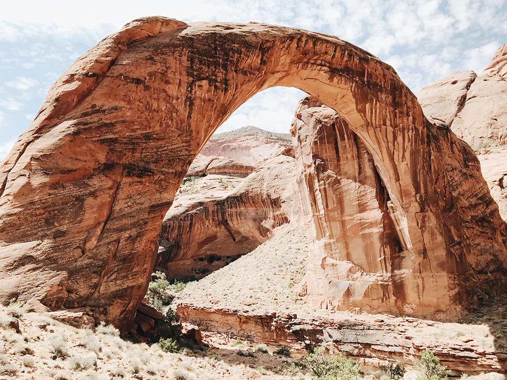 13 Unbelievable National Parks in Utah 75 A rock arch in a nearly perfect arc shape. This formation is known as Rainbow Bridge.