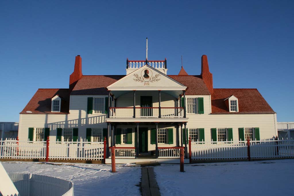 8 Marvelous National Parks in Montana 7 A white house with a red roof in the snow