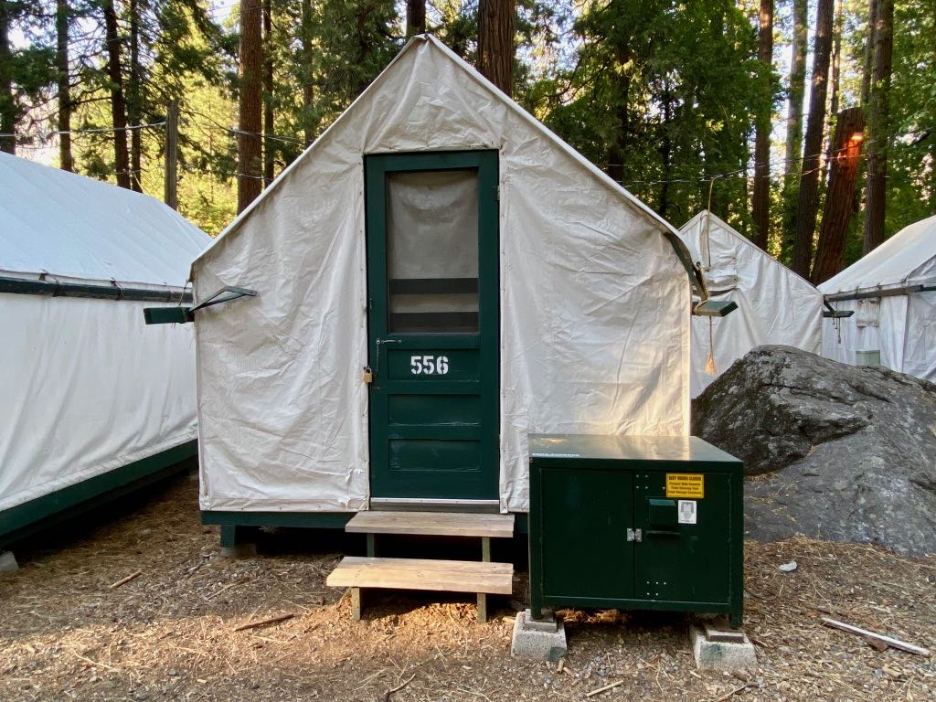 Yosemite Itinerary: 5 Ideas for Day-to-Day Experiences in an Iconic National Park 7 A white canvas tent with a green door