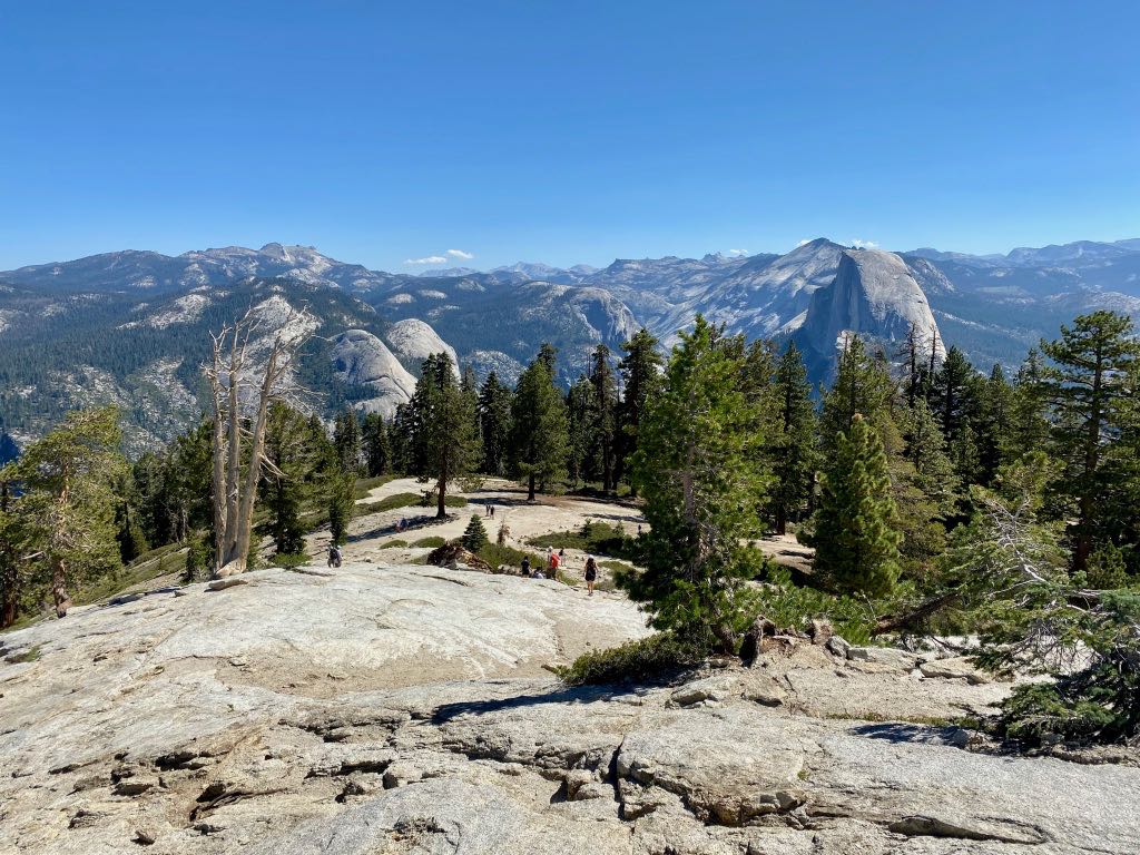 Yosemite Itinerary: 5 Ideas for Day-to-Day Experiences in an Iconic National Park 49 A group of hikers make their way up Sentinel Dome for views of Half Dome and Yosemite Valley.