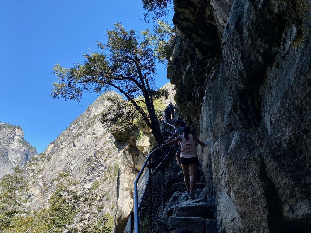 Hiking the Yosemite Mist Trail: Is It Worth the Climb? 35 Hikers climb a narrow granite staircase up the Mist Trail in Yosemite