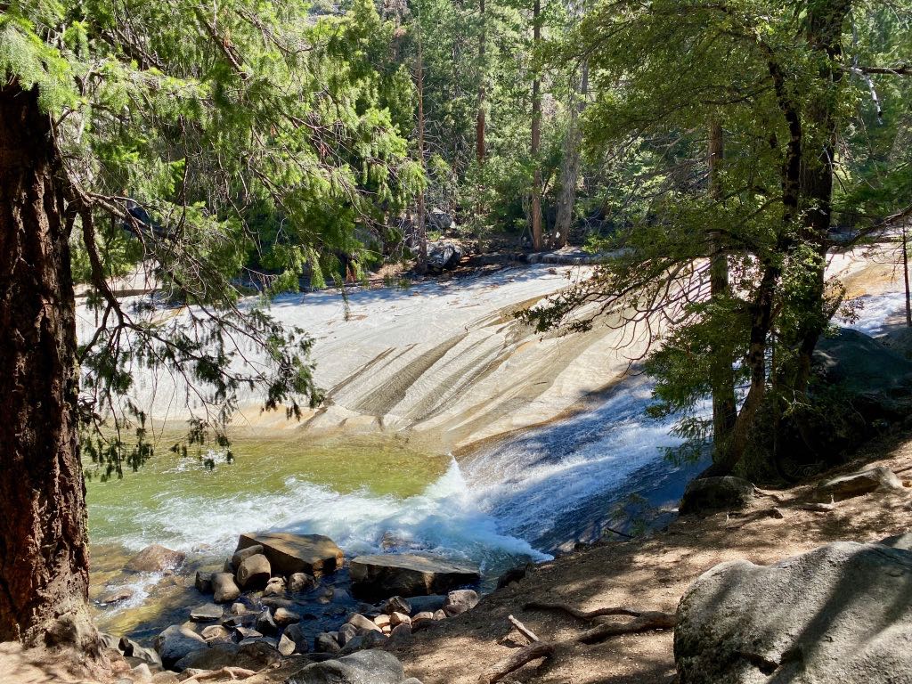 Hiking the Yosemite Mist Trail: Is It Worth the Climb? 38 Water gently falls down slick granite and into a green pool