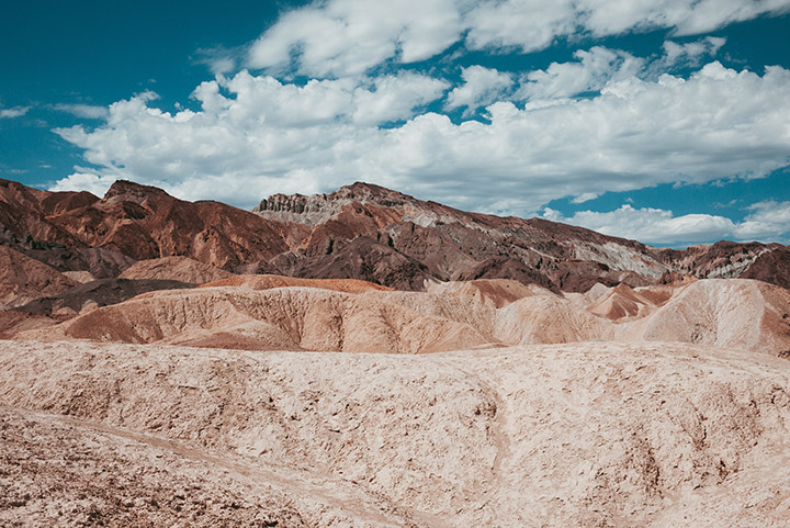 Death Valley National Park 1 Colorful rock formations below a partly cloudy sky