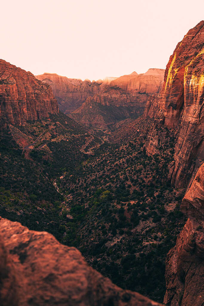 One Day in Zion: 4 Ways to Spend an Epic 24 Hours in Zion National Park 27 A canyon in Zion shines red at sunset