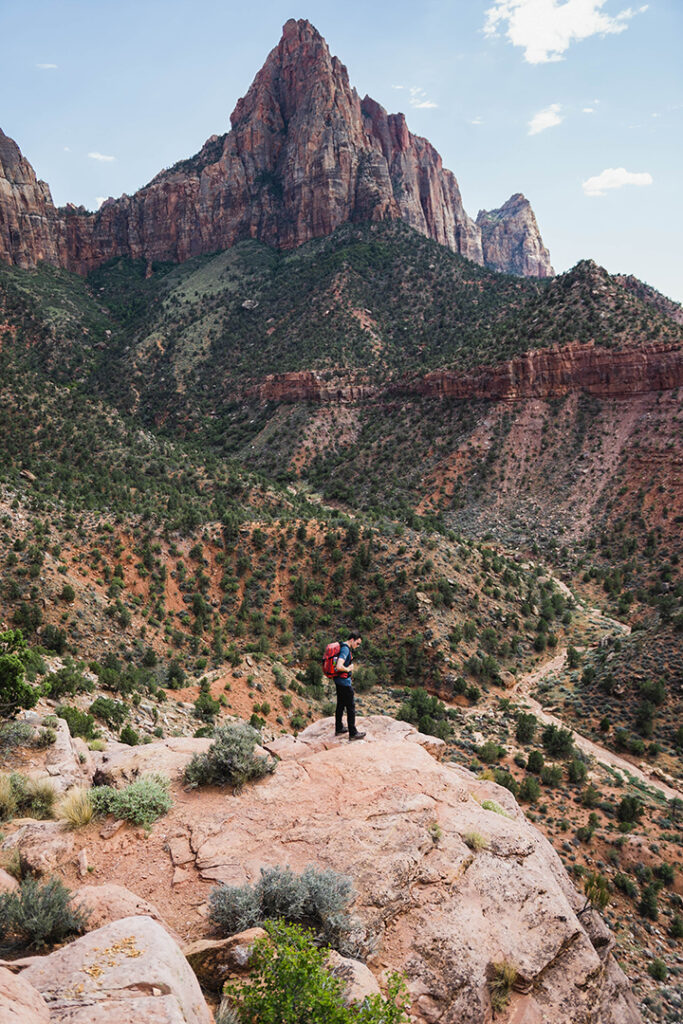 One Day in Zion: 4 Ways to Spend an Epic 24 Hours in Zion National Park 29 A hiker below the Watchman formation in Zion