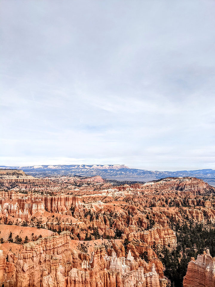 20 Fun Things to Do in Bryce Canyon National Park 21 A gray, cloudy sky above orange hoodoos