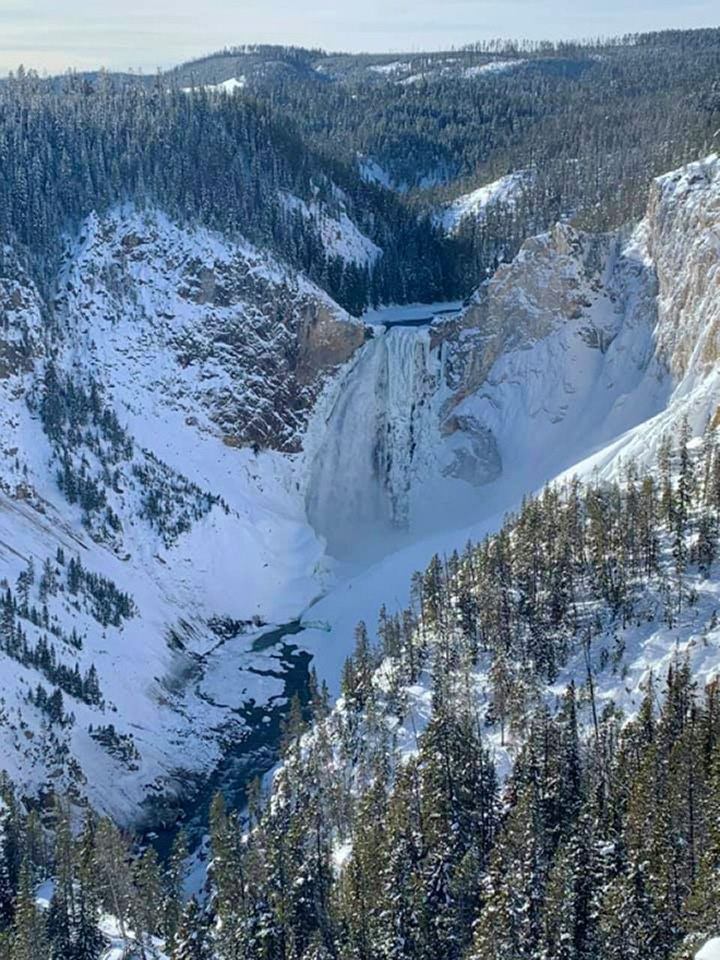 The Parks Expert: A National Park Blog 23 A large waterfall surrounded by snow in Yellowstone in winter