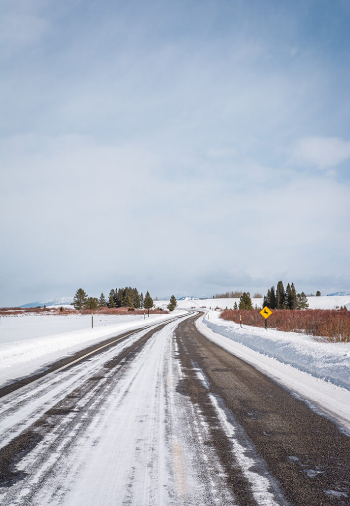 Yellowstone in Winter: Everything You Need to Know for A Spectacular Trip 43 Snow and ice along a paved road