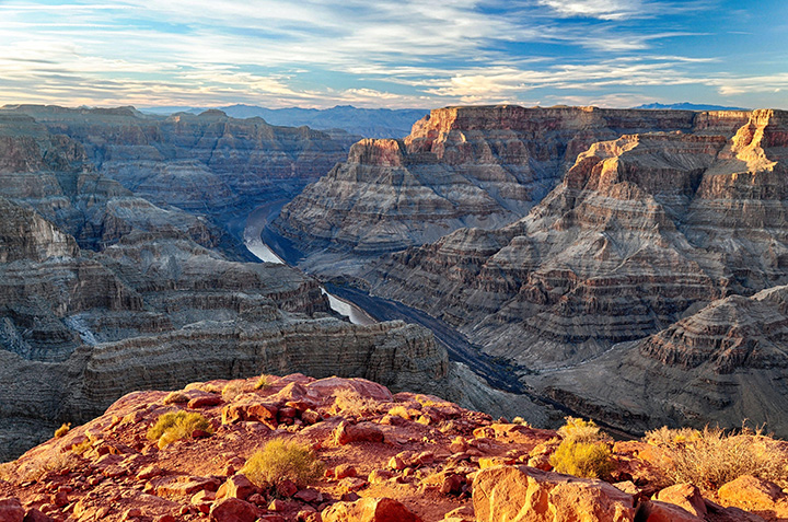 13 Inspiring Things to Do in Grand Canyon National Park 1 The Colorado River runs through a deep red, orange, and brown canyon
