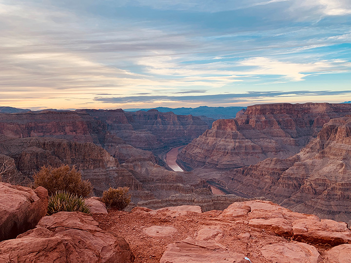 13 Inspiring Things to Do in Grand Canyon National Park 6 A cloudy sky above the red walls of the Grand Canyon as the Colorado River carves its way down the walls