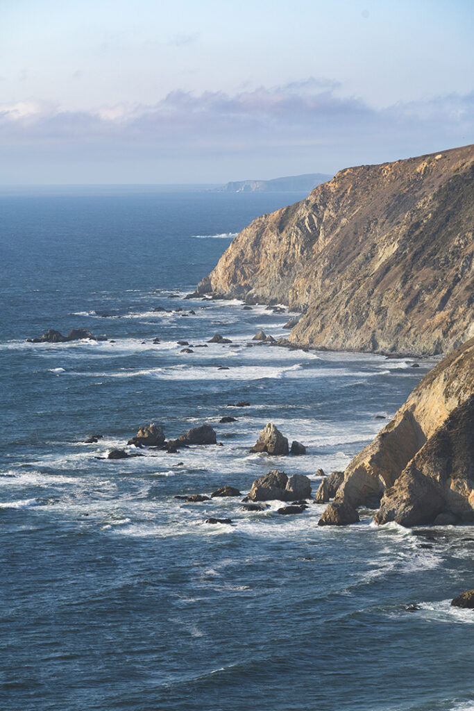 20 Incredible Things to Do in Point Reyes National Seashore 33 Blue ocean waves crash onto white cliffs on the shore