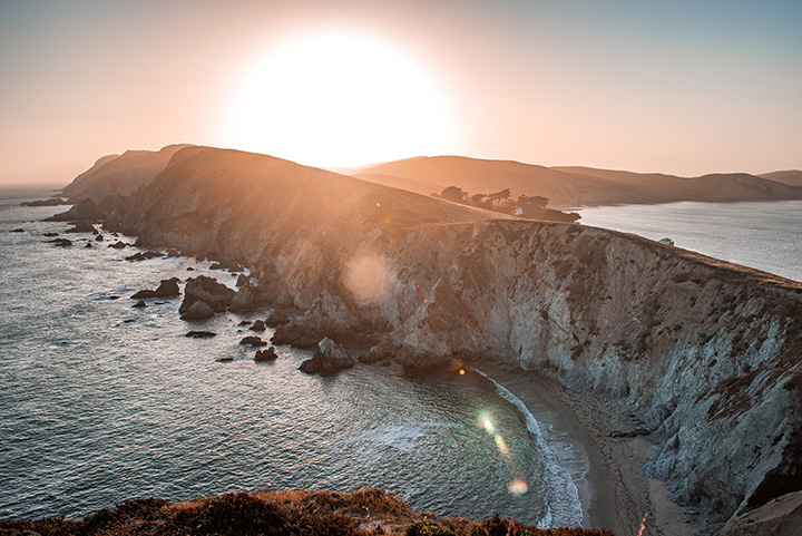 20 Incredible Things to Do in Point Reyes National Seashore 20 The sun sets above white Pacific cliffs