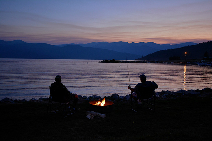 Yellowstone Camping Guide: A Comprehensive Breakdown of the 12 Campgrounds in Yellowstone National Park 7 Two visitors fishing on the shores of a lake