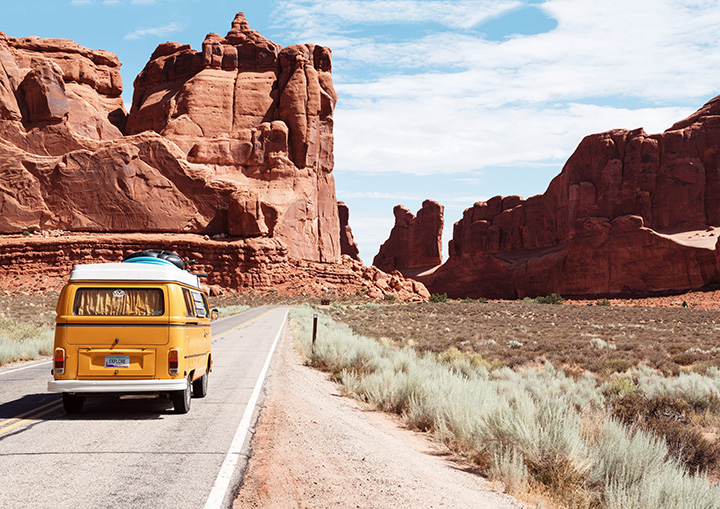 Ultimate Guide to an Epic One Day in Arches National Park Itinerary 7 A yellow van drives the Scenic Drive in Arches National Park itinerary