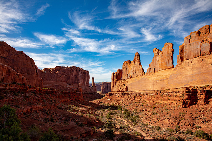 Arches National Park 7 A series of red rock towers on a partly cloudy day