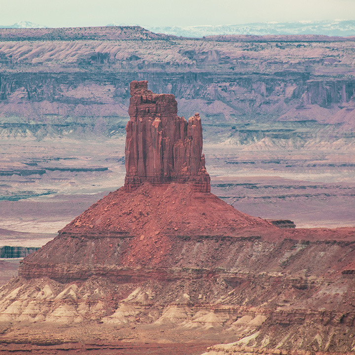 The 15 Best Hikes in Canyonlands National Park: A Comprehensive Guide 8 A sandstone tower rising from a canyon rim