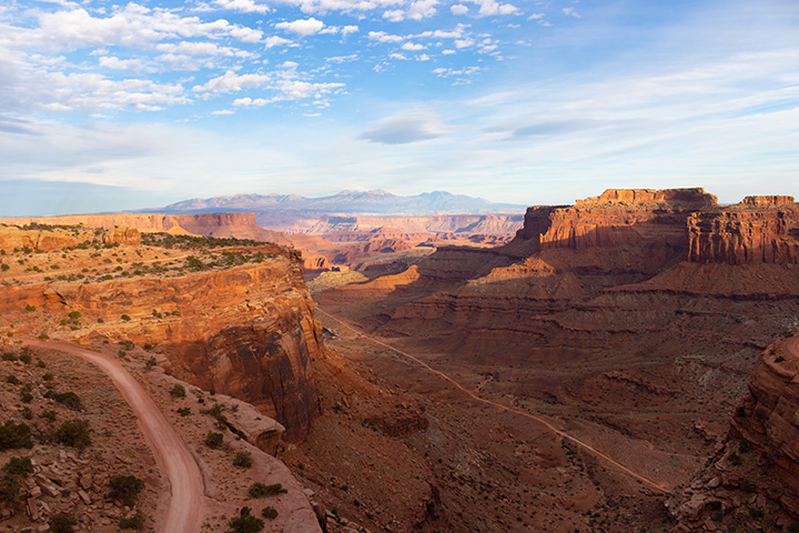 The 15 Best Hikes in Canyonlands National Park: A Comprehensive Guide 24 A dirt road in a canyon