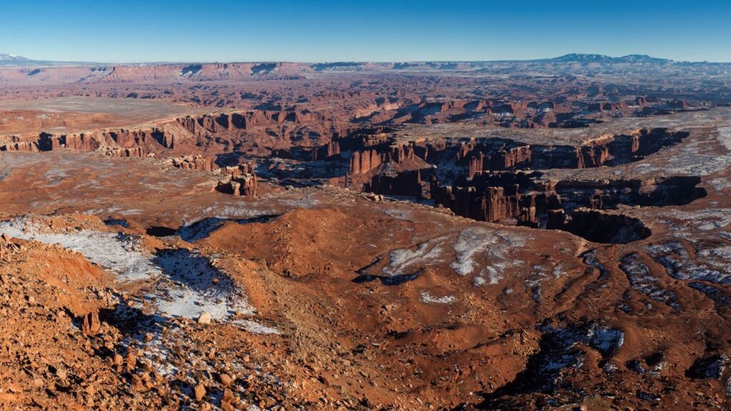 The 15 Best Hikes in Canyonlands National Park: A Comprehensive Guide 29 Snow sprinkled across a desert canyon landscape