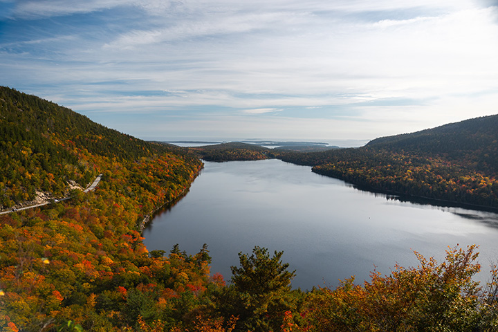 The Best Time to Visit Acadia National Park: When to See Fall Colors 54 Fall colors line the mountains on a lakeside
