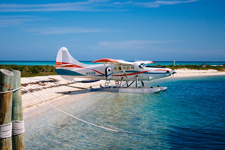 The Absolute Best Time to Visit Dry Tortugas National Park 17 A white seaplane parked on a beach